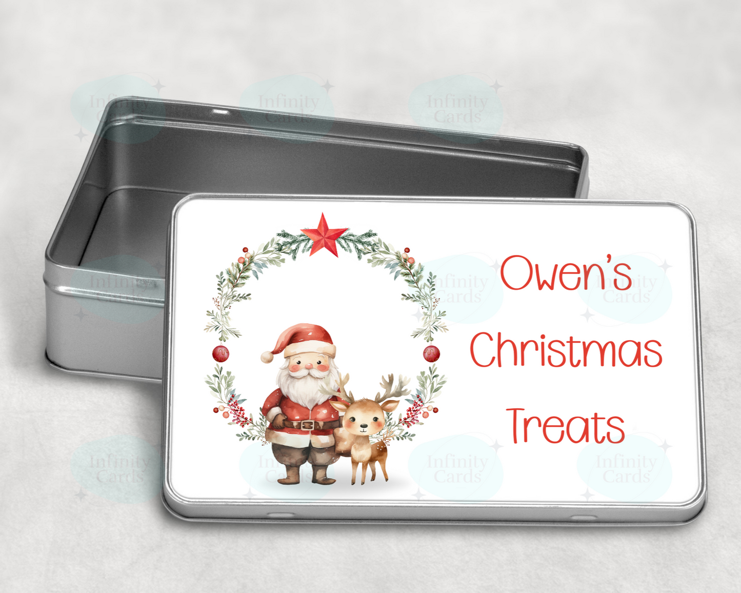 Metal tin with a Christmas-themed label featuring Santa Claus and a reindeer, on a light gray background.