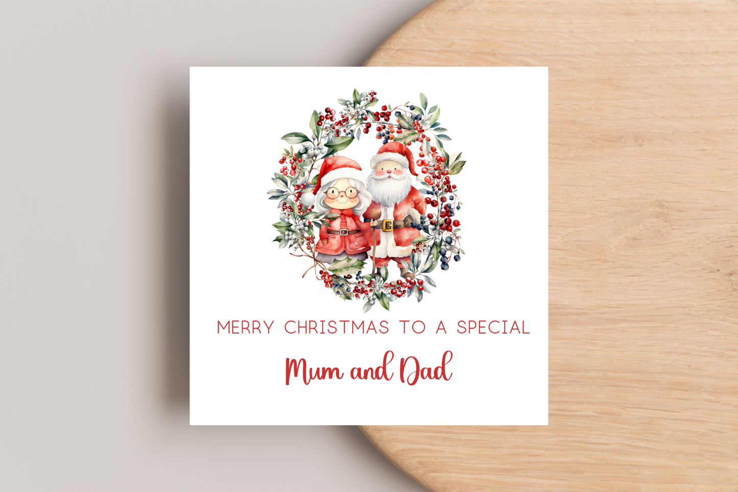 Personalised Santa and Mrs Claus in Wreath Christmas Card