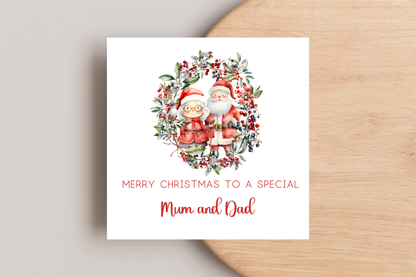 Personalised Santa and Mrs Claus in Wreath Christmas Card