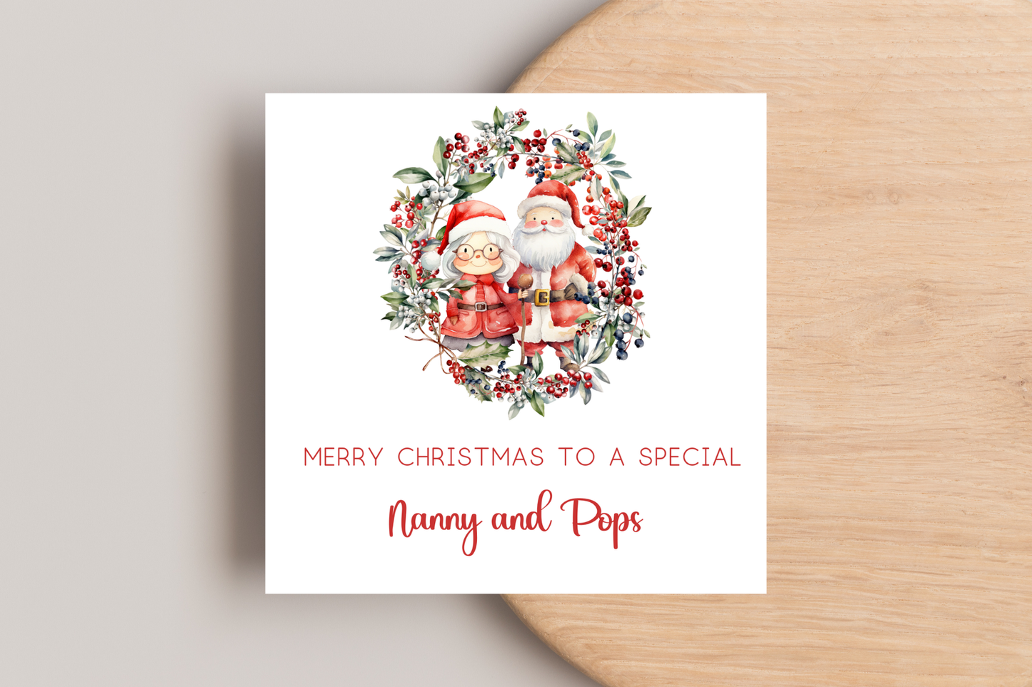 Personalised Santa and Mrs Claus in Wreath Christmas Card