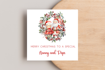Personalised Santa and Mrs Claus in Wreath Christmas Card