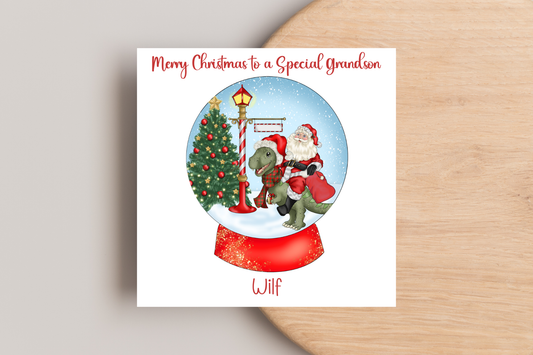 Santa riding a Dinosaur in a Snow Globe Christmas Card