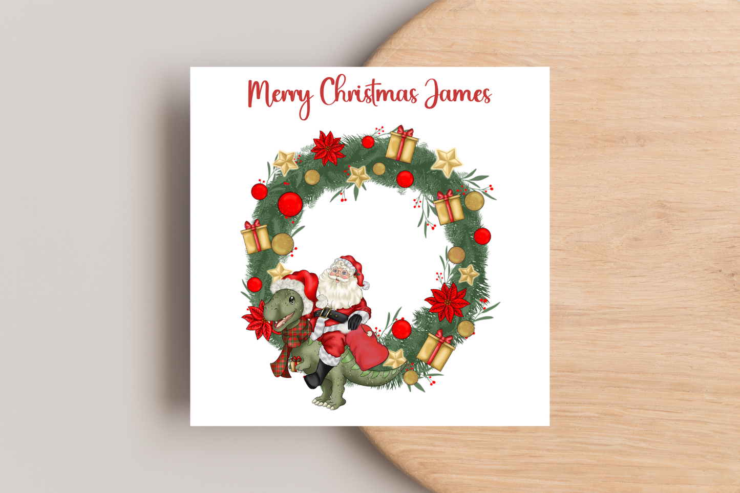 Santa riding a Dinosaur in a Wreath Christmas Card- Personalised