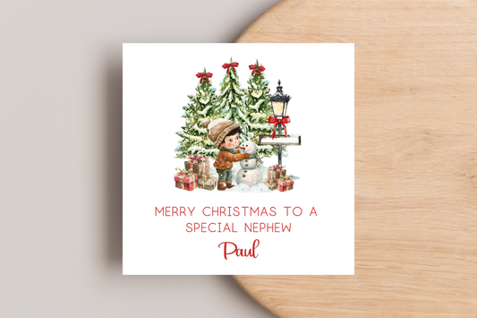 Personalised Snowman Building Little Boy Christmas Card