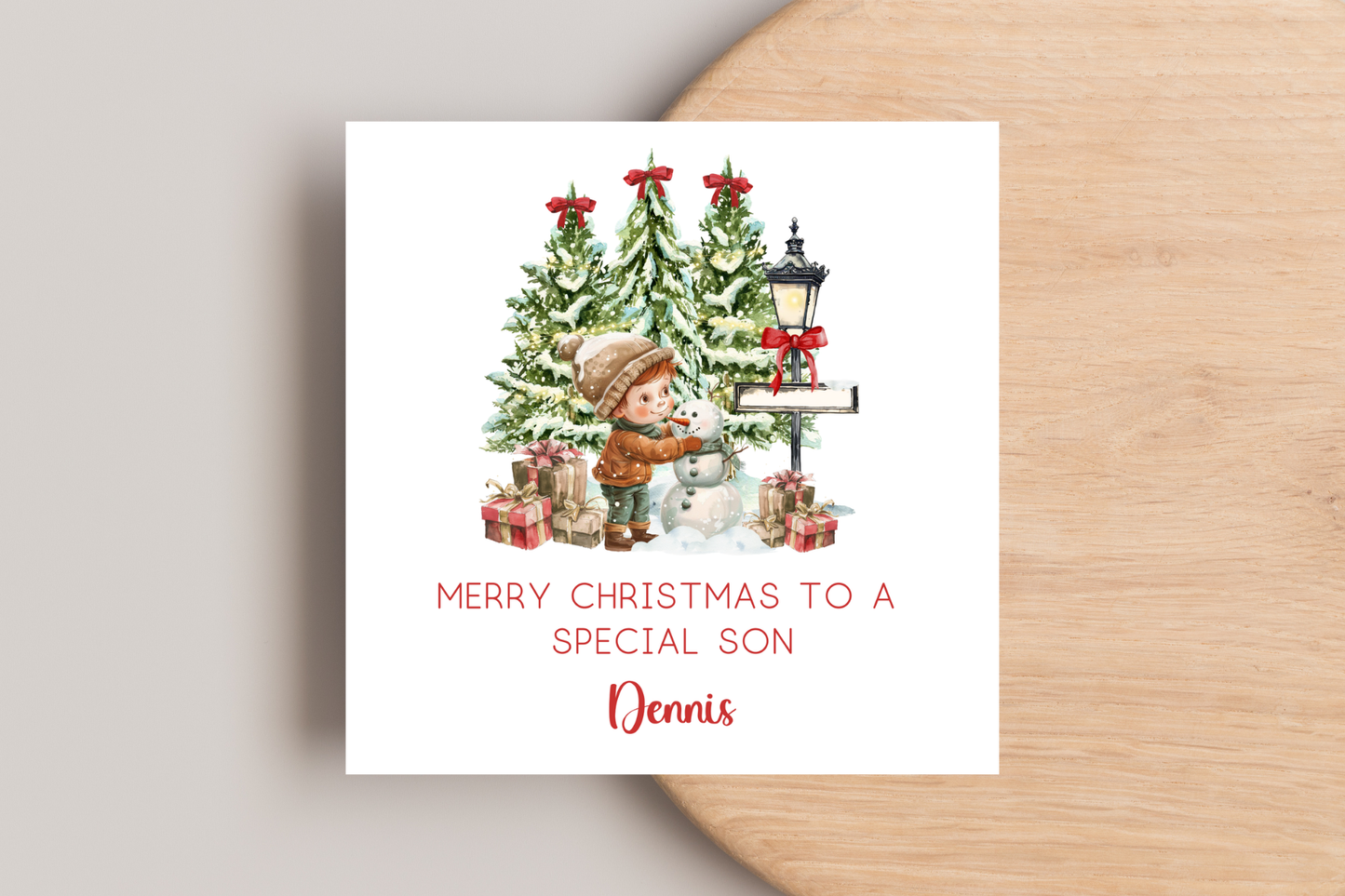 Personalised Snowman Building Little Boy Christmas Card