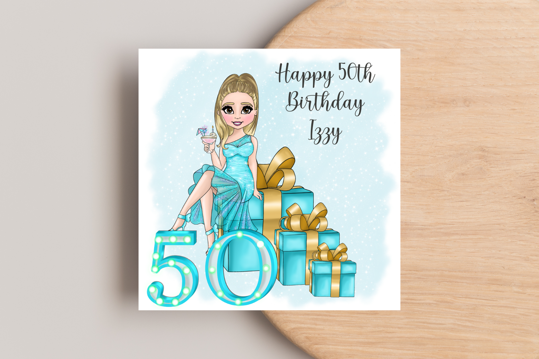 50th Birthday Card Personalised- Lady in Blue Dress Sitting on Glittering Presents