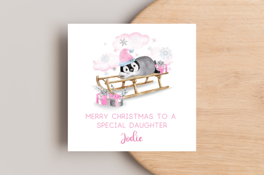 Personalised Penguin Sledging Christmas Card