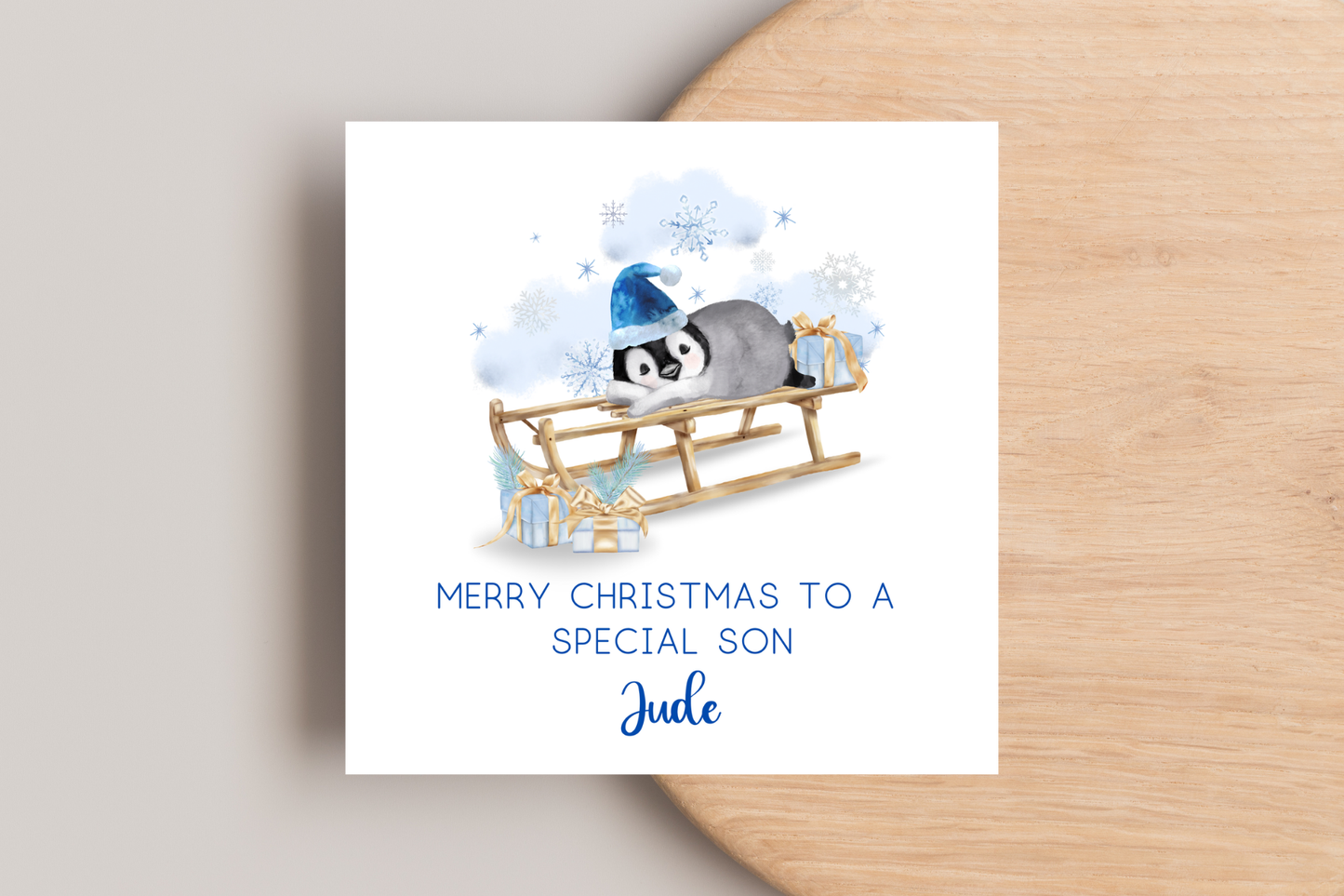 Personalised Penguin Sledging Christmas Card