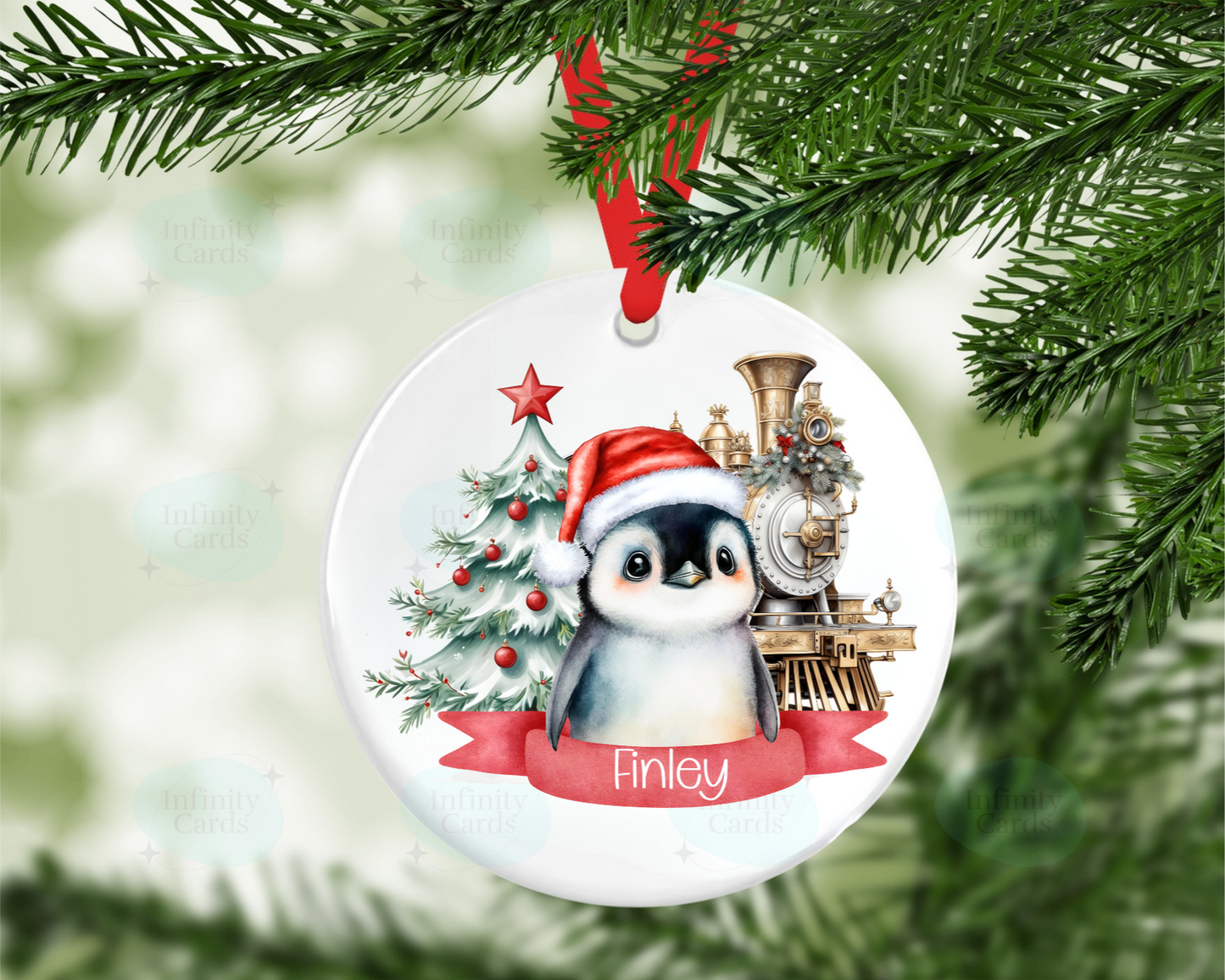 Christmas ornament with a penguin wearing a Santa hat and train design, hanging on a tree.