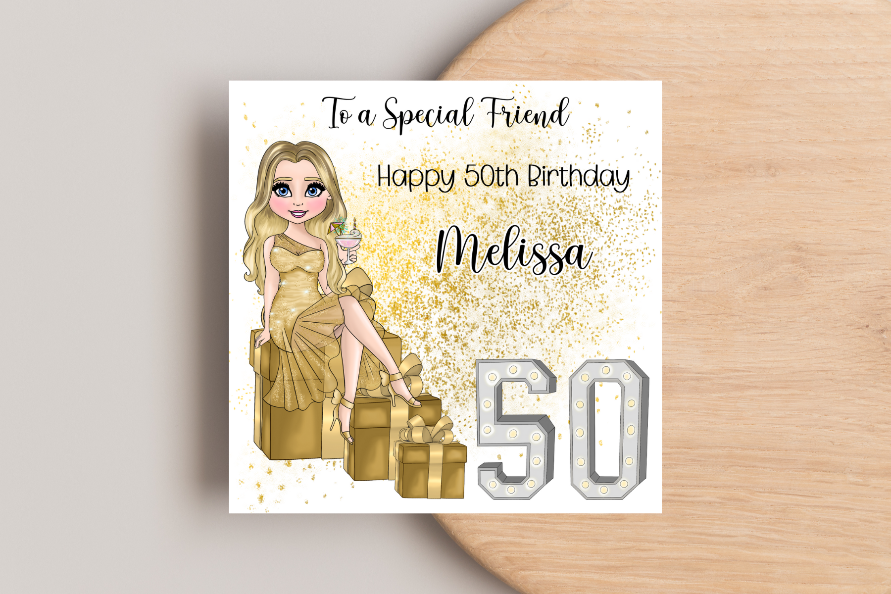 50th Birthday Card Personalised- Customisable Lady in Gold Dress Sitting on Glittering Presents with Age in Light-Up Numbers